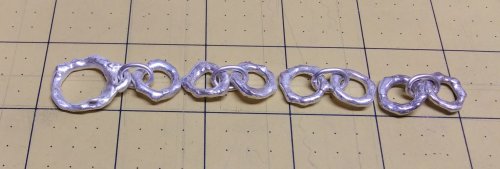 Judy Larson's Argentium Silver Scrap Chain - , Contemporary Wire Jewelry, Making Chain, Chain Making , Butane Torch, Soldering, Solder, Use flat nose pliers to bend a jump ring into an oval shape